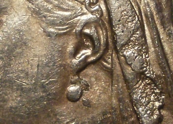 Die-Error-By-Earring-On-Obverse-Of-1887-Half-Crown?